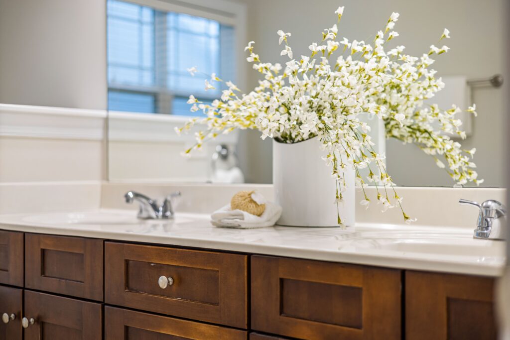 Beautiful apartment bathroom with healthy indoor plants in ceramic pots